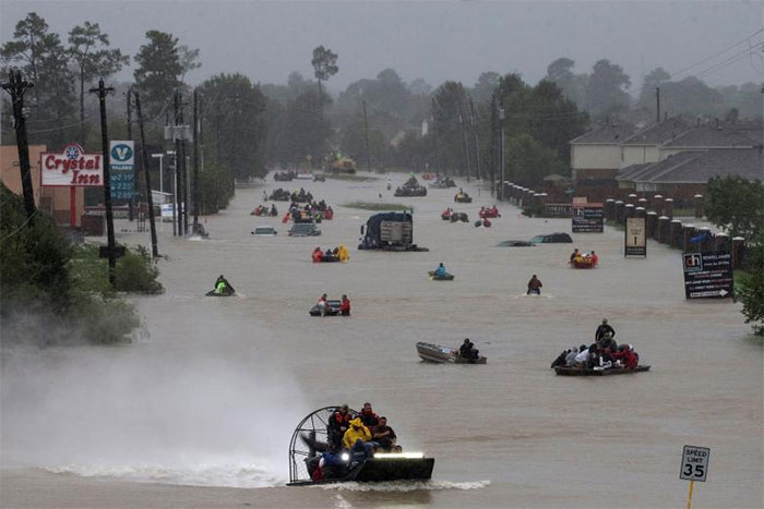 Residents Use Boats To Evacuate Flood Waters Along Tidwell Road In East Houston, Texas