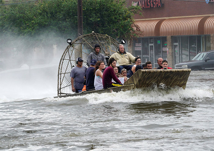 People Are Rescued From Flood Waters From Hurricane Harvey On An Air Boat In Dickinson