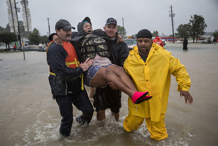 Karen Preston Was Carried To Safety After Evacuating Her Flooded Neighborhood On The Outskirts Of Houston