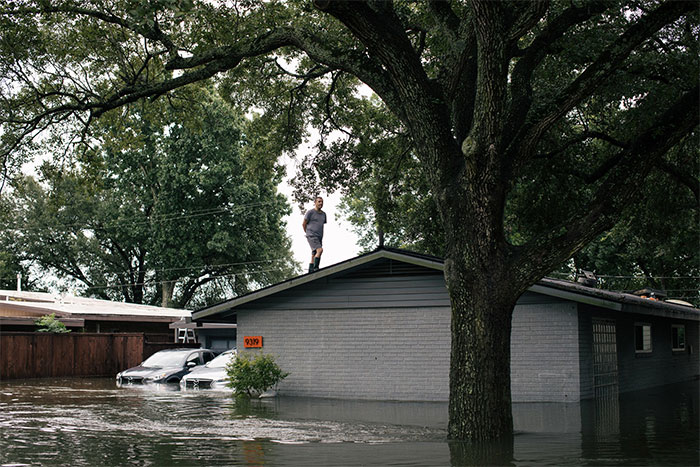 A Resident In The Meyerland Neighborhood Of Houston Took To A Rooftop As Floodwaters Inundated The Area