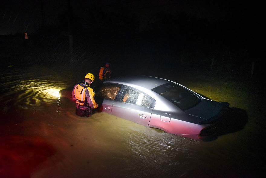 Rescue Staff From The Municipal Emergency Management Agency Investigate An Empty Flooded Car During The Passage Of Hurricane Irma Through The Northeastern Part Of The Island In Fajardo, Puerto Rico