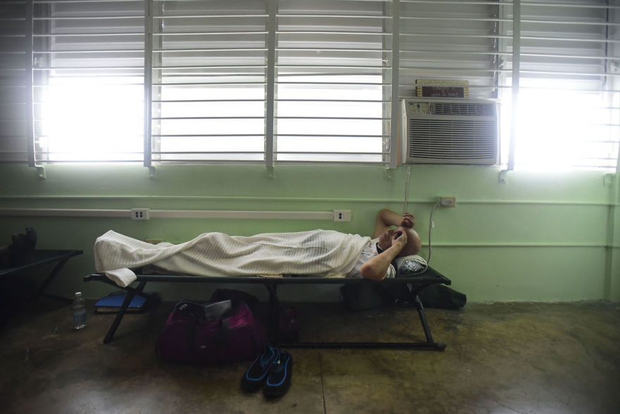 A Man Rests On A Cot Inside A Shelter Set Up At The Berta Zalduondo Elementary School During The Passage Of Hurricane Irma In Fajardo, Puerto Rico