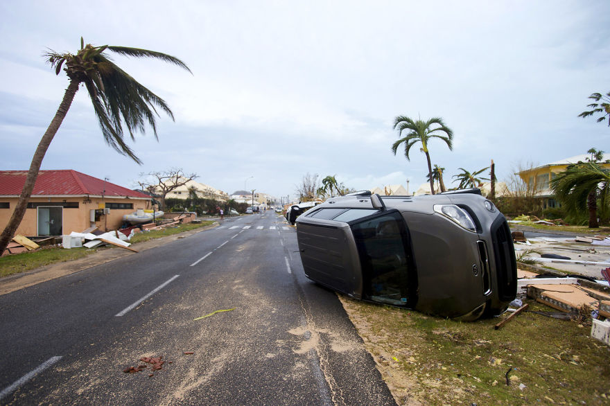 A Car Is Left Turned Onto Its Side From Hurricane Winds In Marigot, Saint Martin, On Wednesday