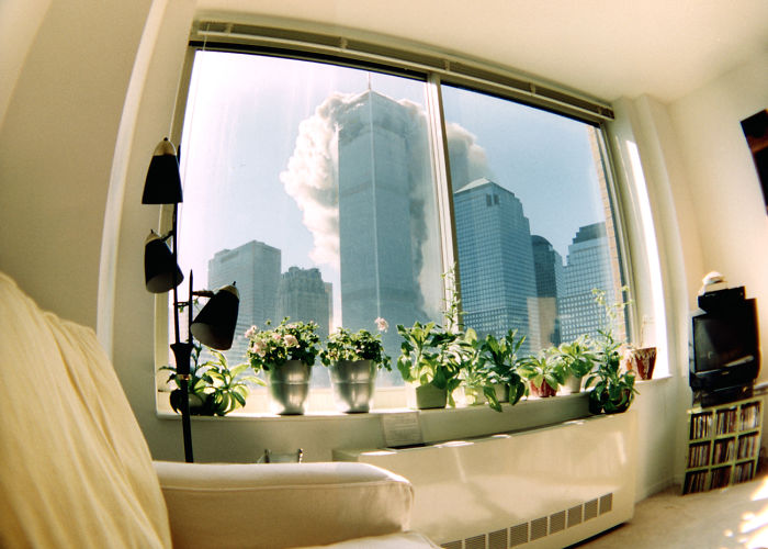As Seen Through A Fish-Eye Lens From An Apartment Four Blocks Away, Smoke Streams From The North Tower Within Minutes Of The First Plane’s Attack