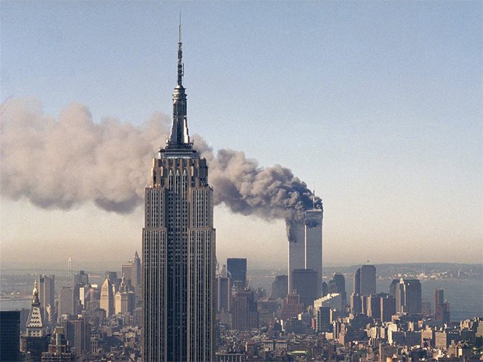 Twin Towers Of The World Trade Center Burn Behind The Empire State Building