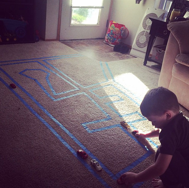 Put Masking Tape On A Carpet For Your Kid To Play With Toy Cars
