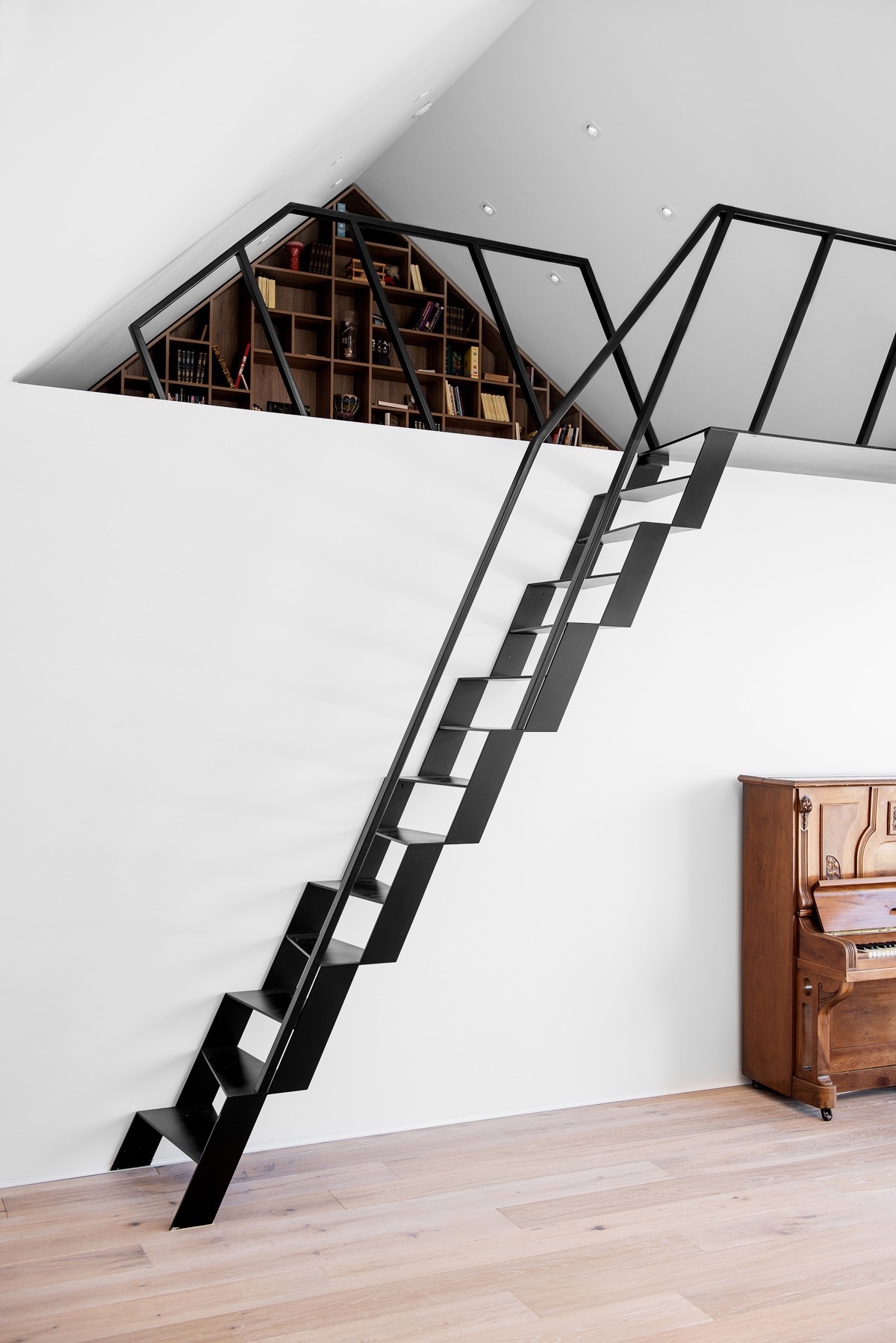 Cat ladder style staircases are good solution in limited space, like when access to a mezzanine level is required from a main living area.