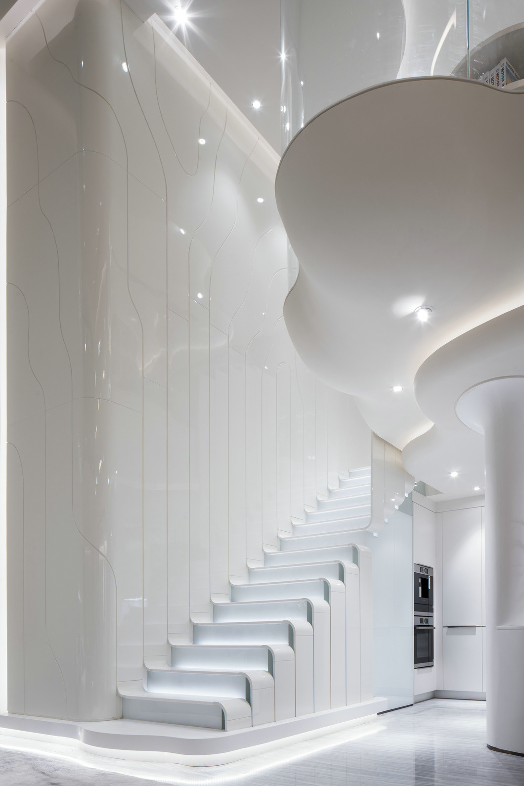 Fulfill a futuristic fantasy. Glossy white steps merge with light reflective wall panels in this futuristic home design. Softly glowing stair lights accentuate the recessed risers.