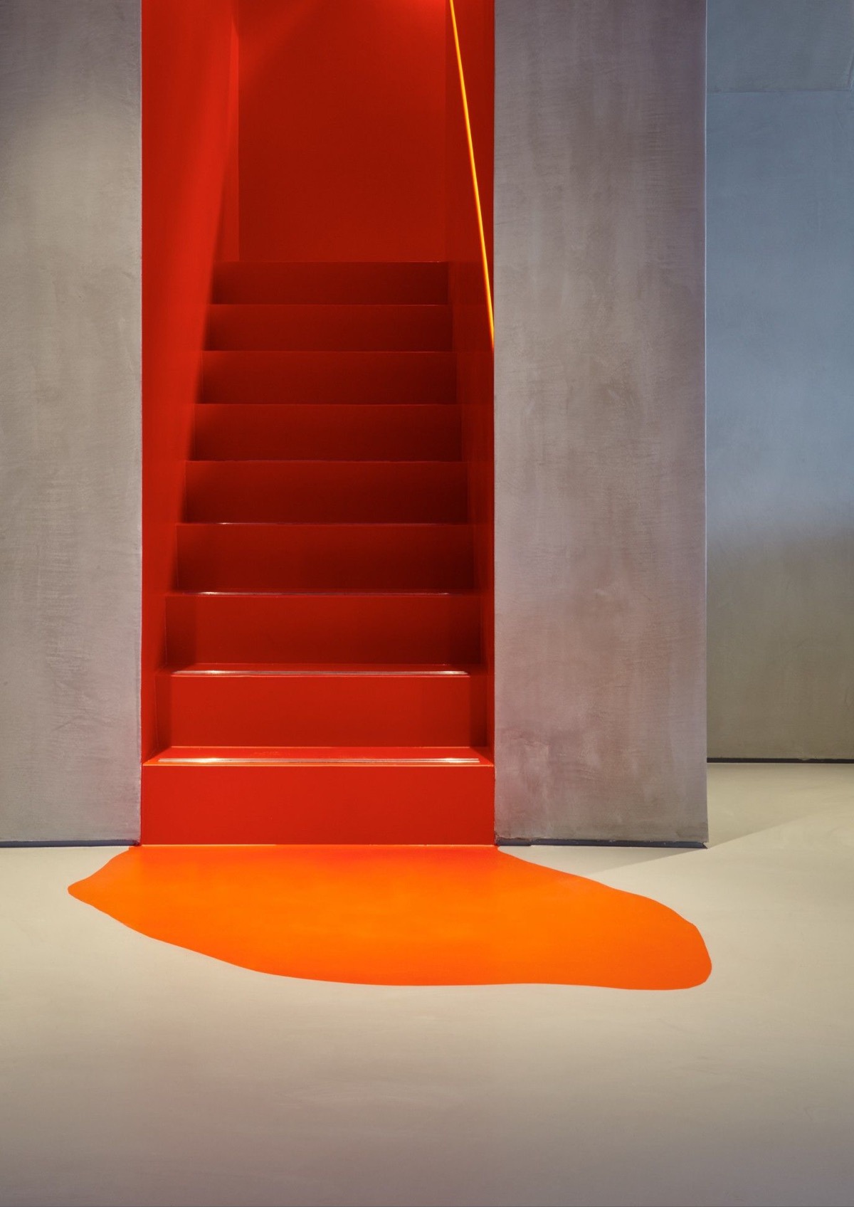 Let your favorite color spill from the stairwell out onto the floor of your entryway for artistic effect.