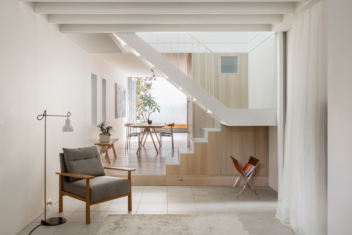 Many open plan dreams are thwarted by the awkward placement of an immovable staircase, but don’t be discouraged. With some coercing your stubborn central staircase could become a mere accent in the room. Think blending wall panels on the lower half, and low profile open treads to the ceiling space.