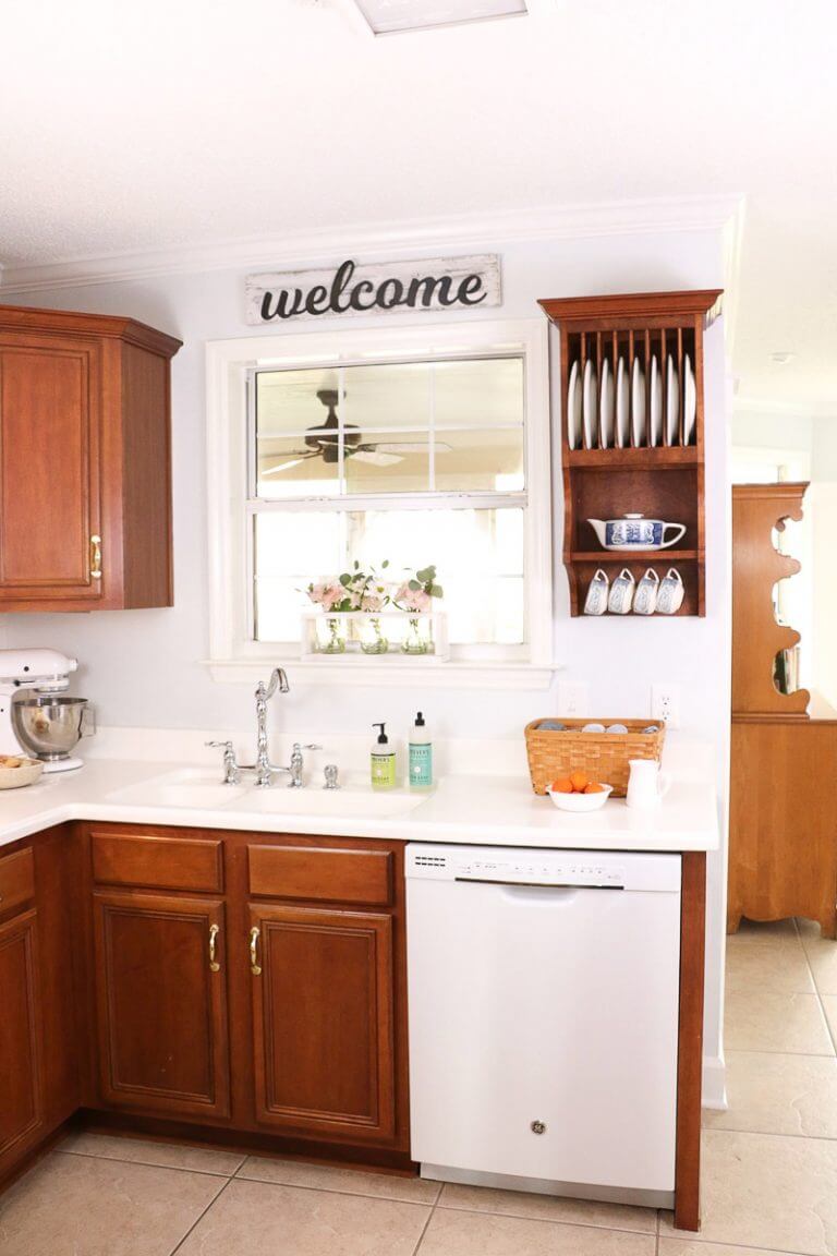 Wood & White Kitchen with Welcome Sign