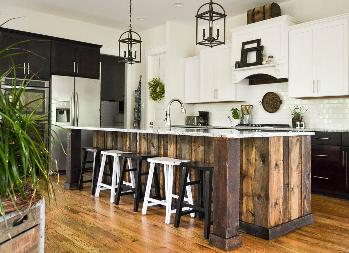 Wood Paneled Kitchen Island With Industrial Lights