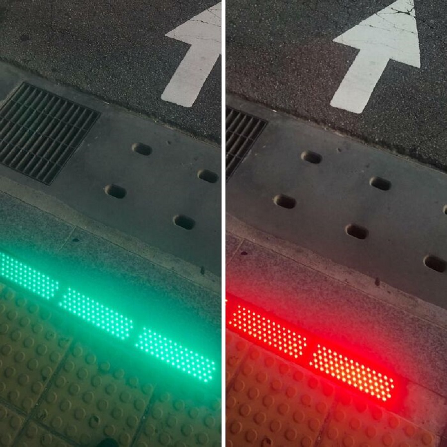 This Traffic Light On The Sidewalk For Pedestrians On Their Phones