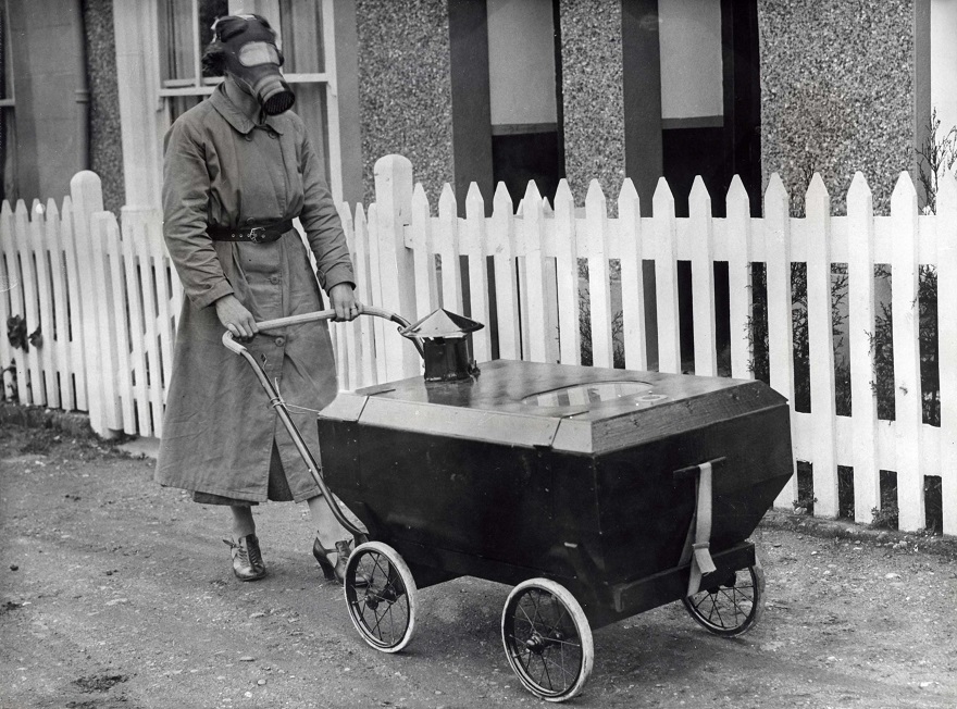 Pictured Below Is A Woman Wearing A Gas Mask And Pushing A Gas-Resistant Pram In England During 1938