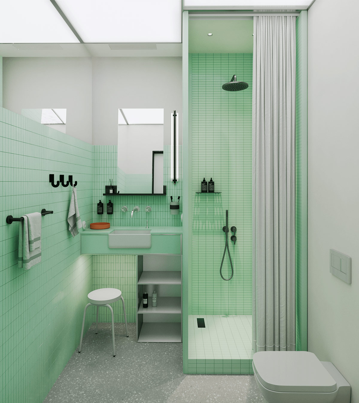 A white farmhouse sink and black bathroom fixtures break up this bold, seafoam green bathroom design.