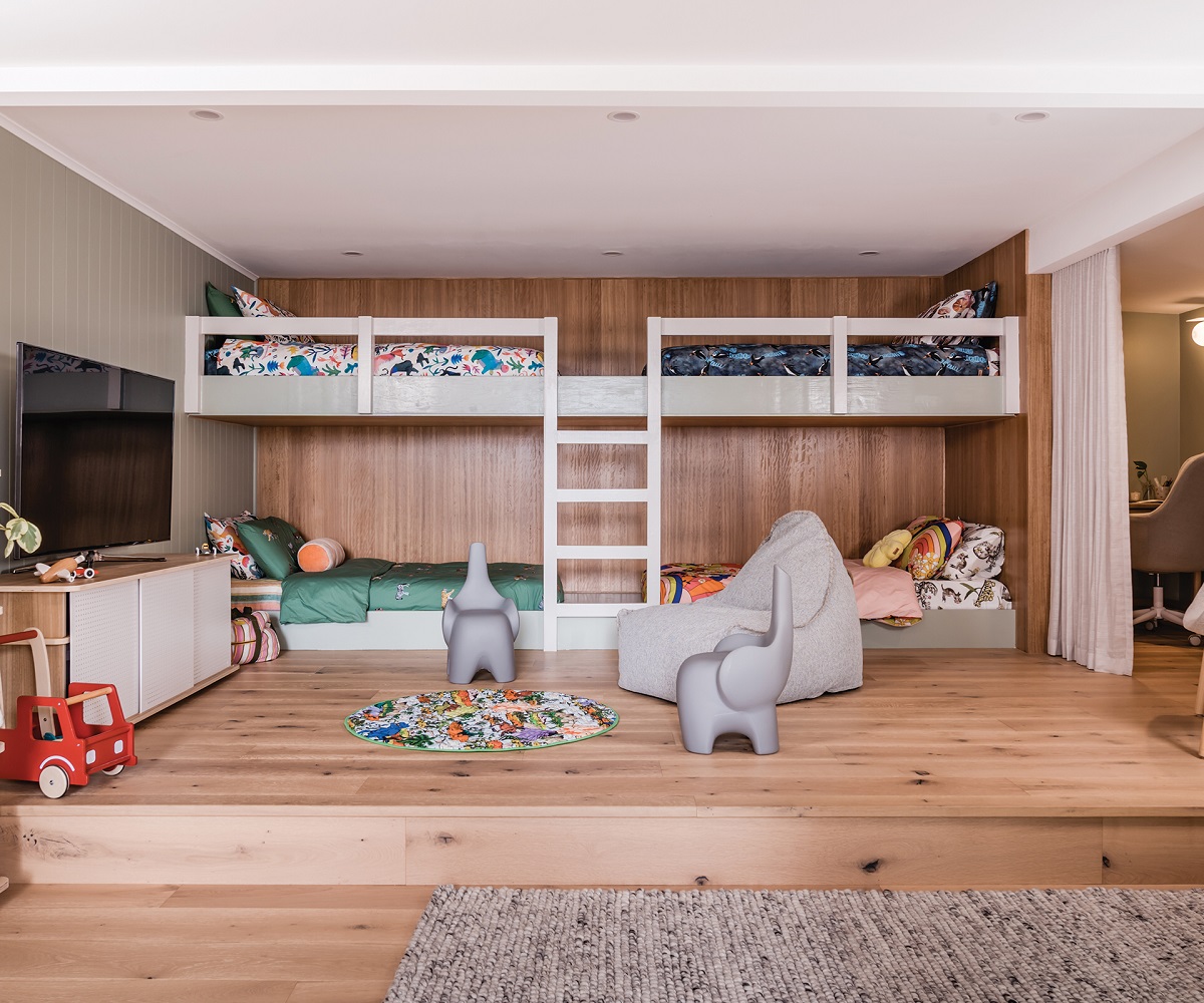 At this Lorne beach house, designed by Hunting for George, a clever kids' rumpus/retreat provides space for four children plus a baby in the nursery tucked away to the right.