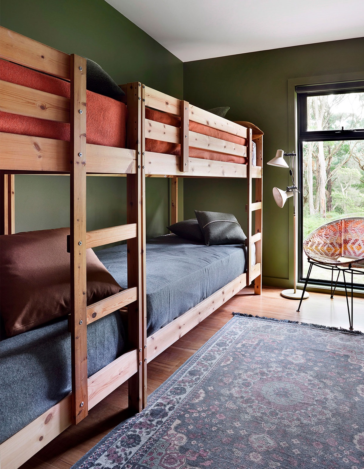 Busy Melburnians Simone and David Kelly craved a place to escape to regularly. The bush-inspired weekender features bunk beds in a more sophisticated style that is perfect for accommodating children and adults.