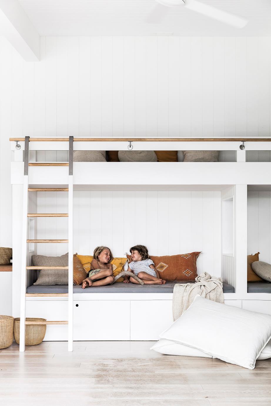 A weatherboard home in tropical Byron Bay is a blissful oasis for a busy couple and their three young kids. In the bungalow, a pair of bunk beds made by Vardy Build create a kid-friendly zone.