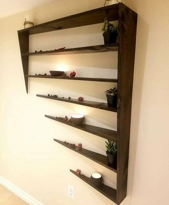 This Shelf Is Designed To Look Like It Is Phasing Into A Wall