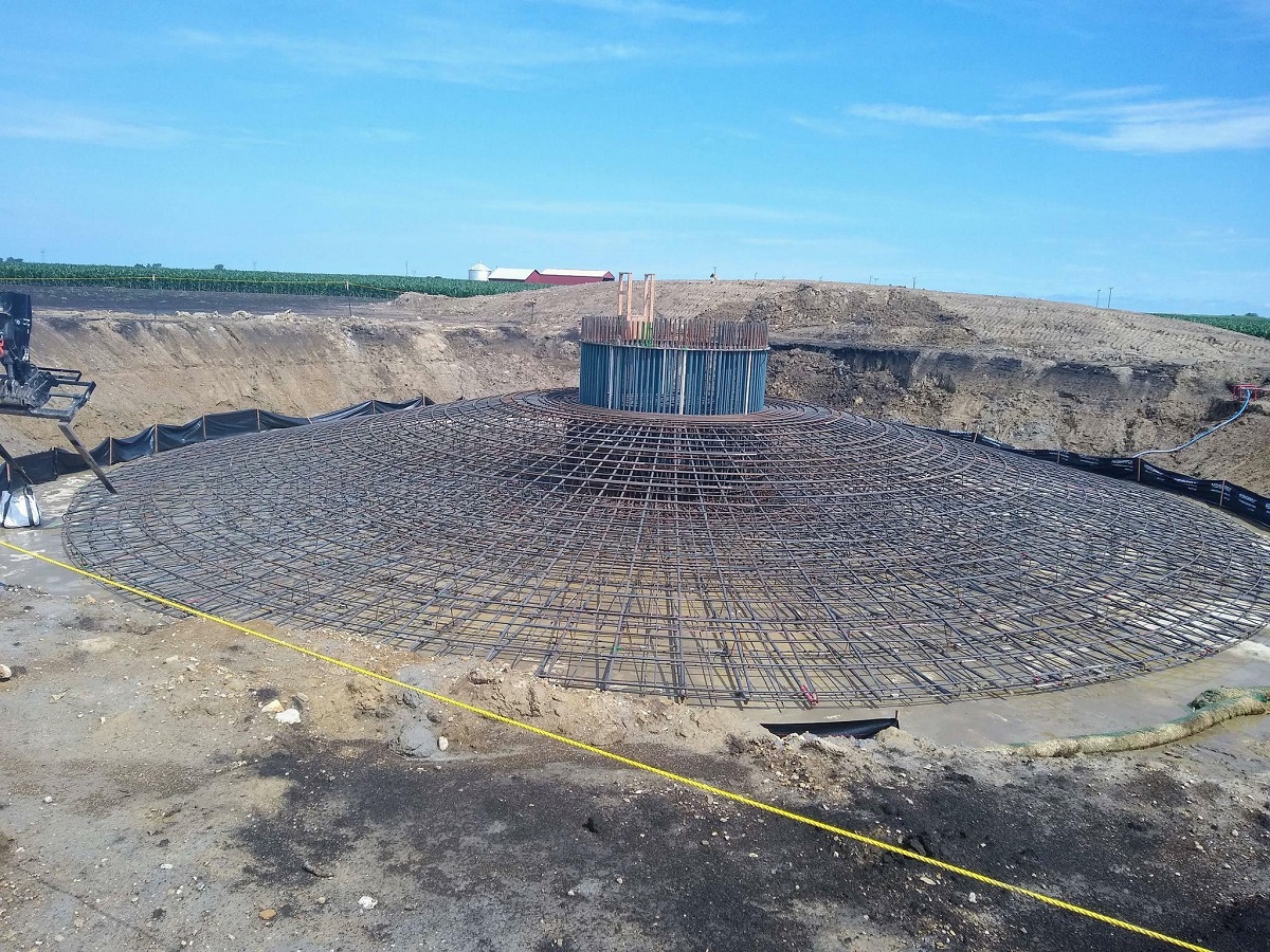 A Wind Turbine Base Before Concrete Is Poured Over The Rebar And Bolt Cage