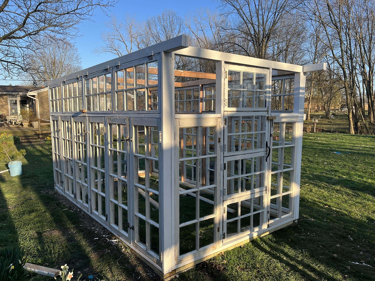 Husband Bought 32 Old Windows And Is Using Them To Build Us A Greenhouse. It still Needs A Roof, But it Looks So Cool