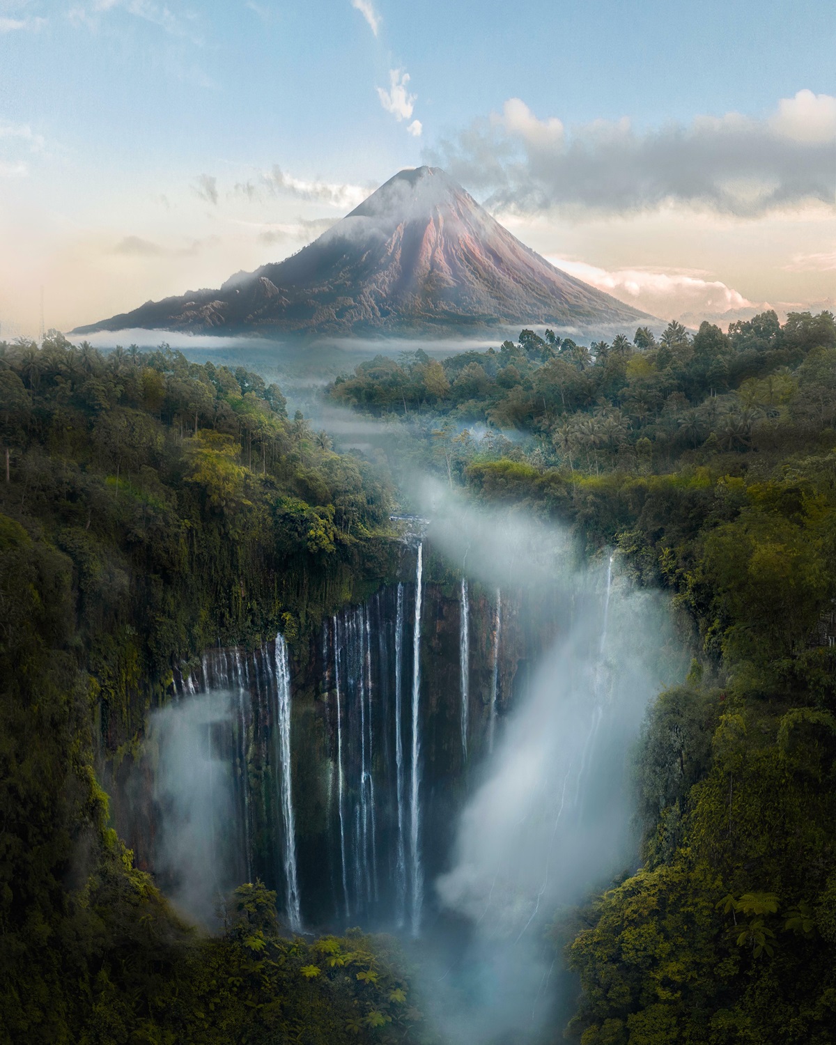 You Might Have Seen It Before, But Here's That One Place In Indonesia With A Volcano Behind Waterfalls