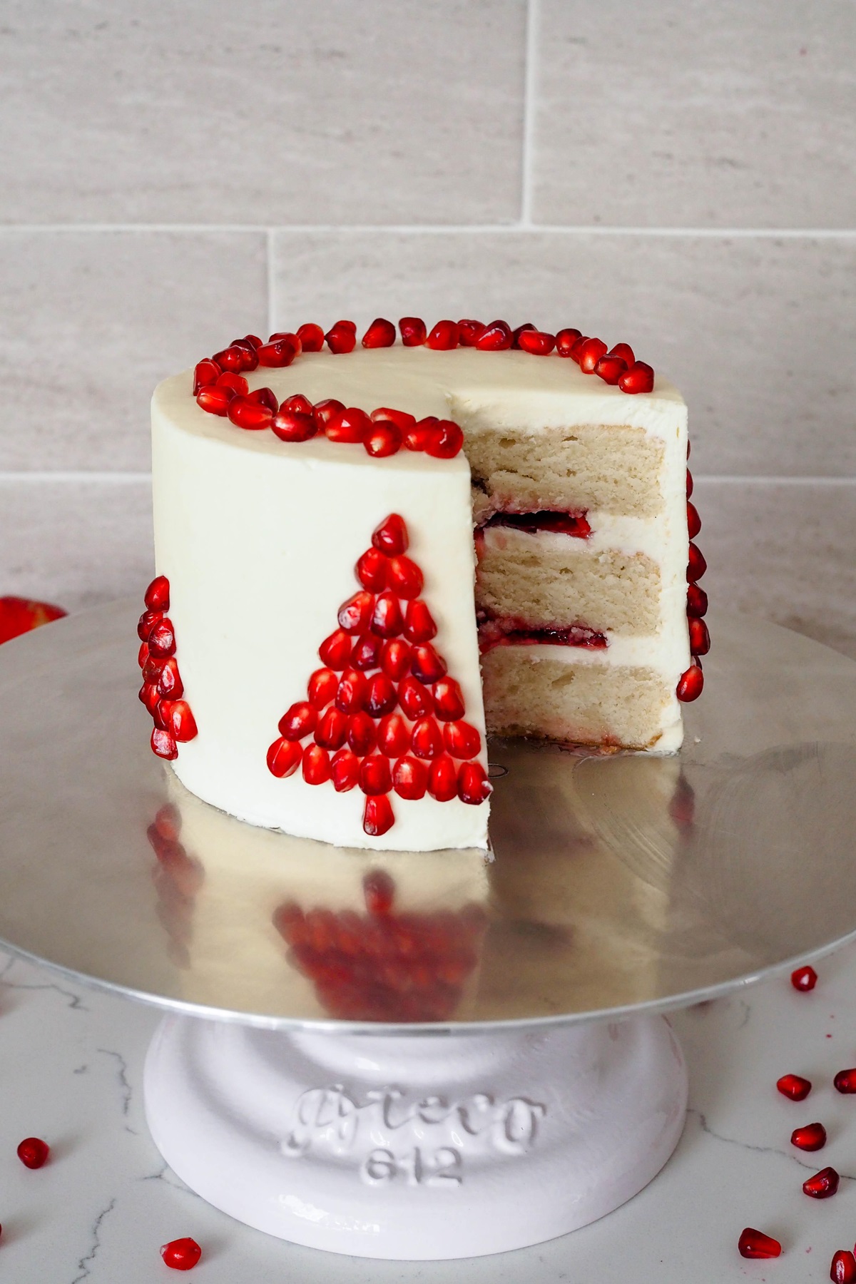 I Used Pomegranate Arils To Make Christmas Trees On The Side Of This White Chocolate Pomegranate Cake, And It Turned Out So Cute
